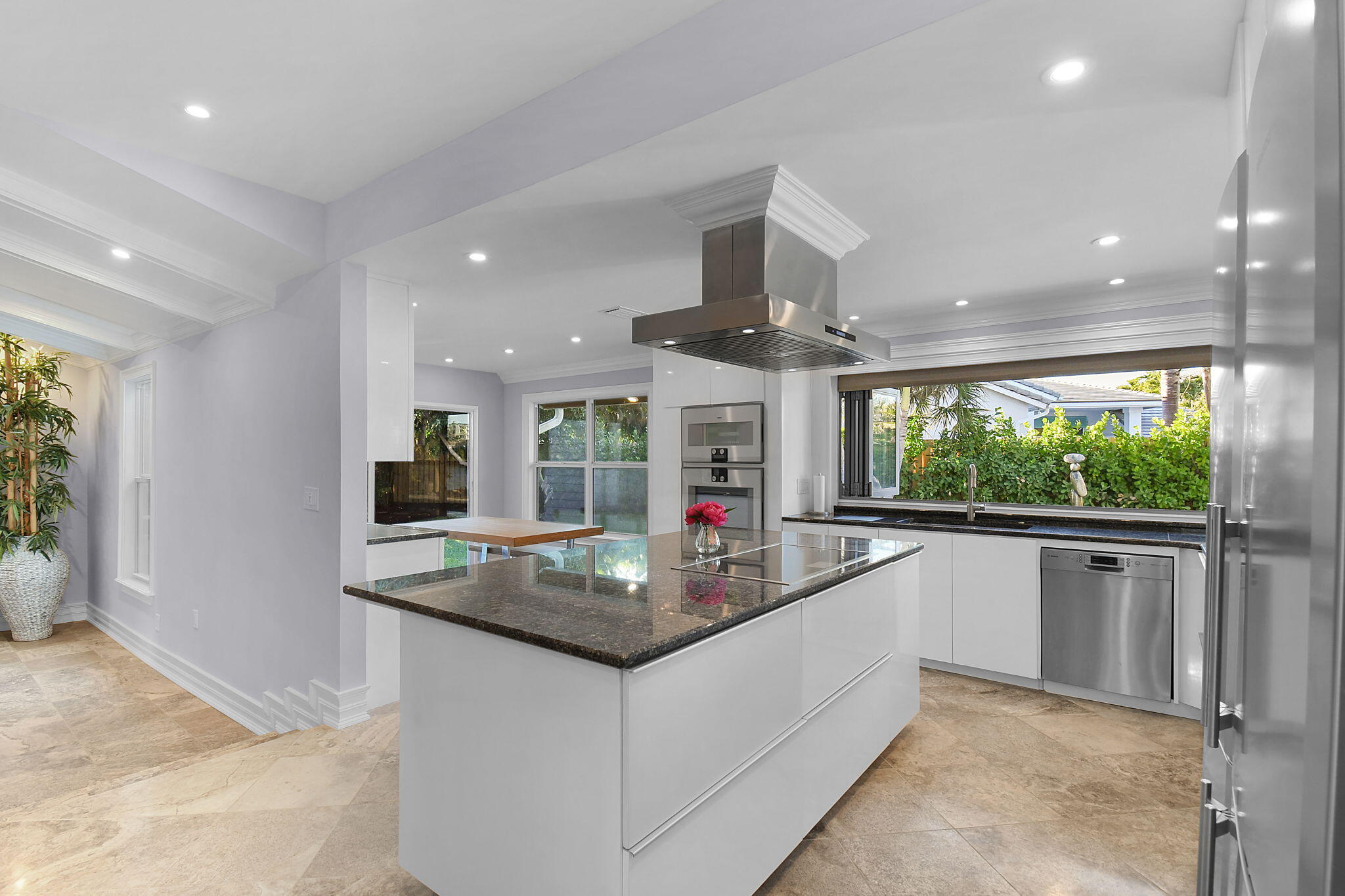 123 Olympus Way Jupiter, FL 33477 - Photo 39 of 116 a kitchen with stainless steel appliances granite countertop a sink a stove and a refrigerator