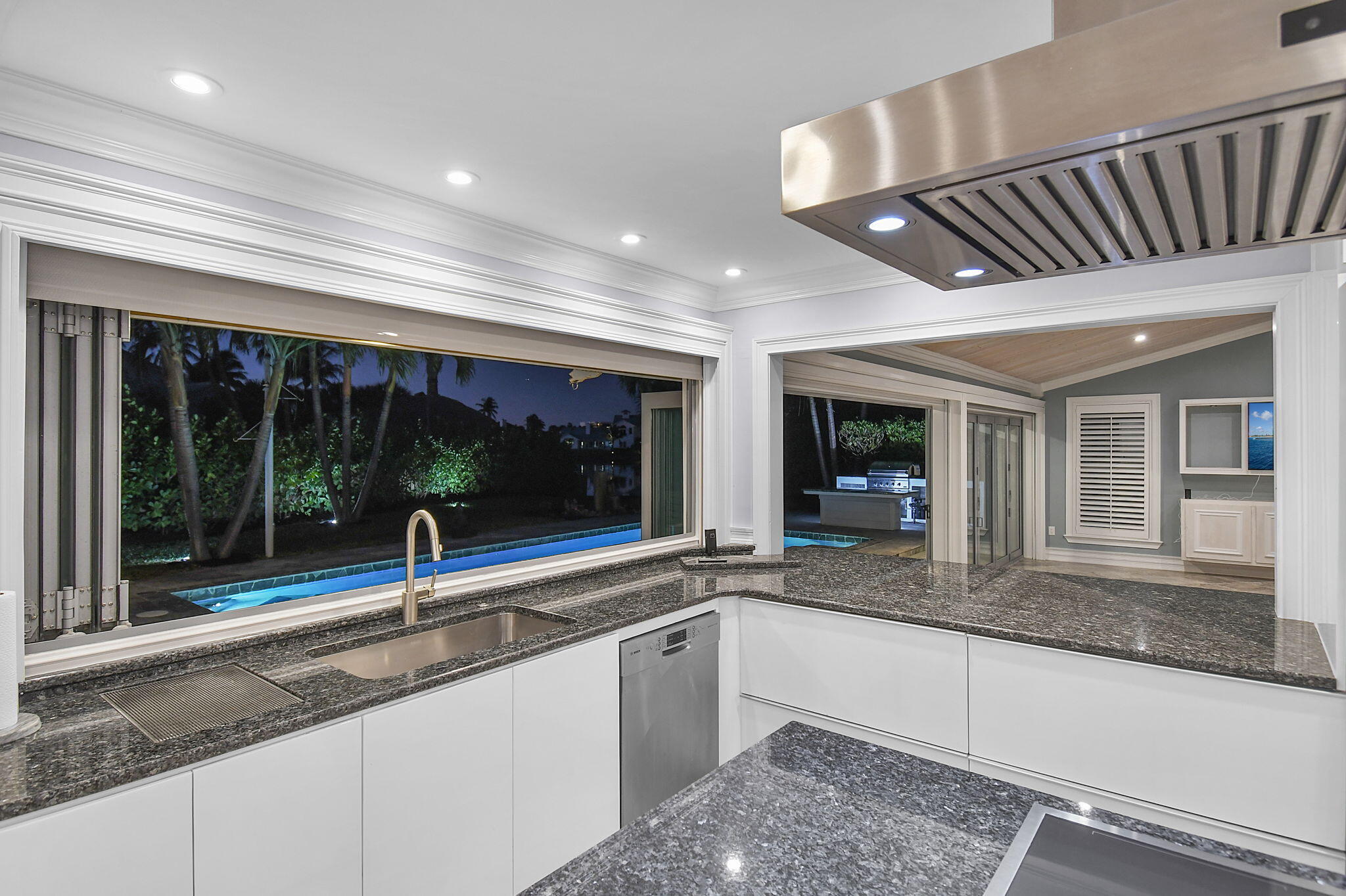 123 Olympus Way Jupiter, FL 33477 - Photo 45 of 116 a large kitchen with granite countertop a large window and a sink