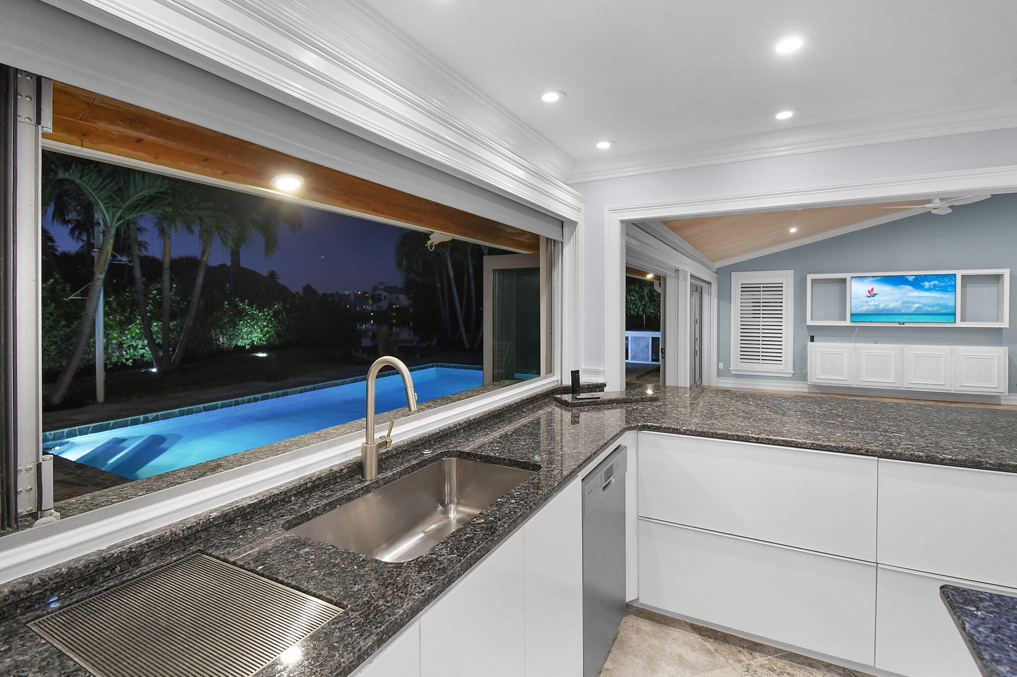 123 Olympus Way Jupiter, FL 33477 - Photo 49 of 116 a kitchen with granite countertop a sink and a counter top space