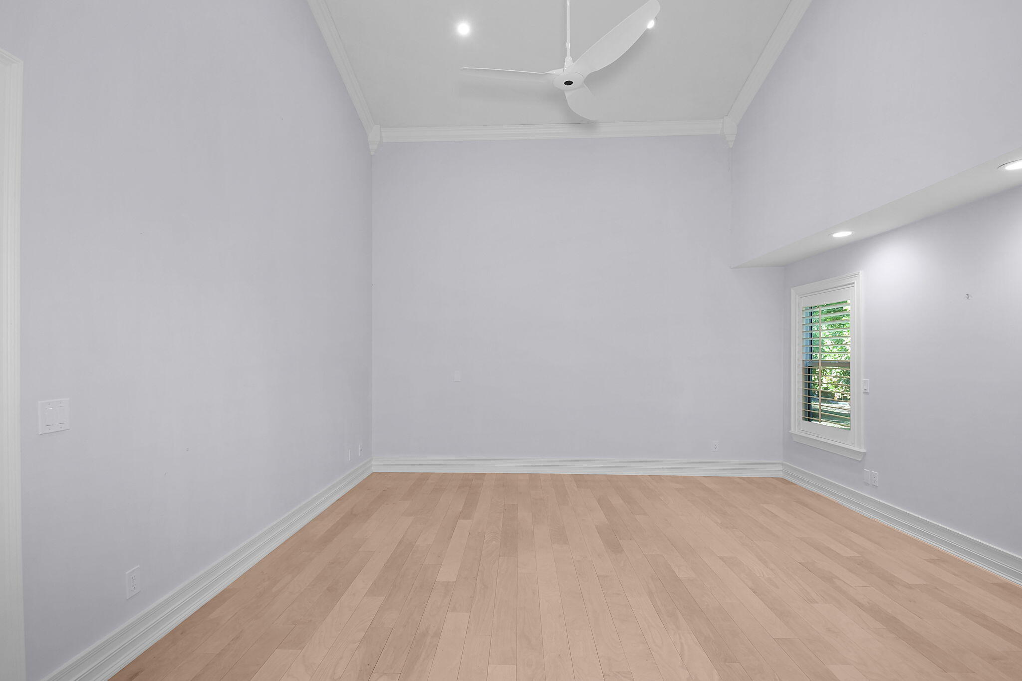 123 Olympus Way Jupiter, FL 33477 - Photo 66 of 116 an empty room with a window and wooden floor