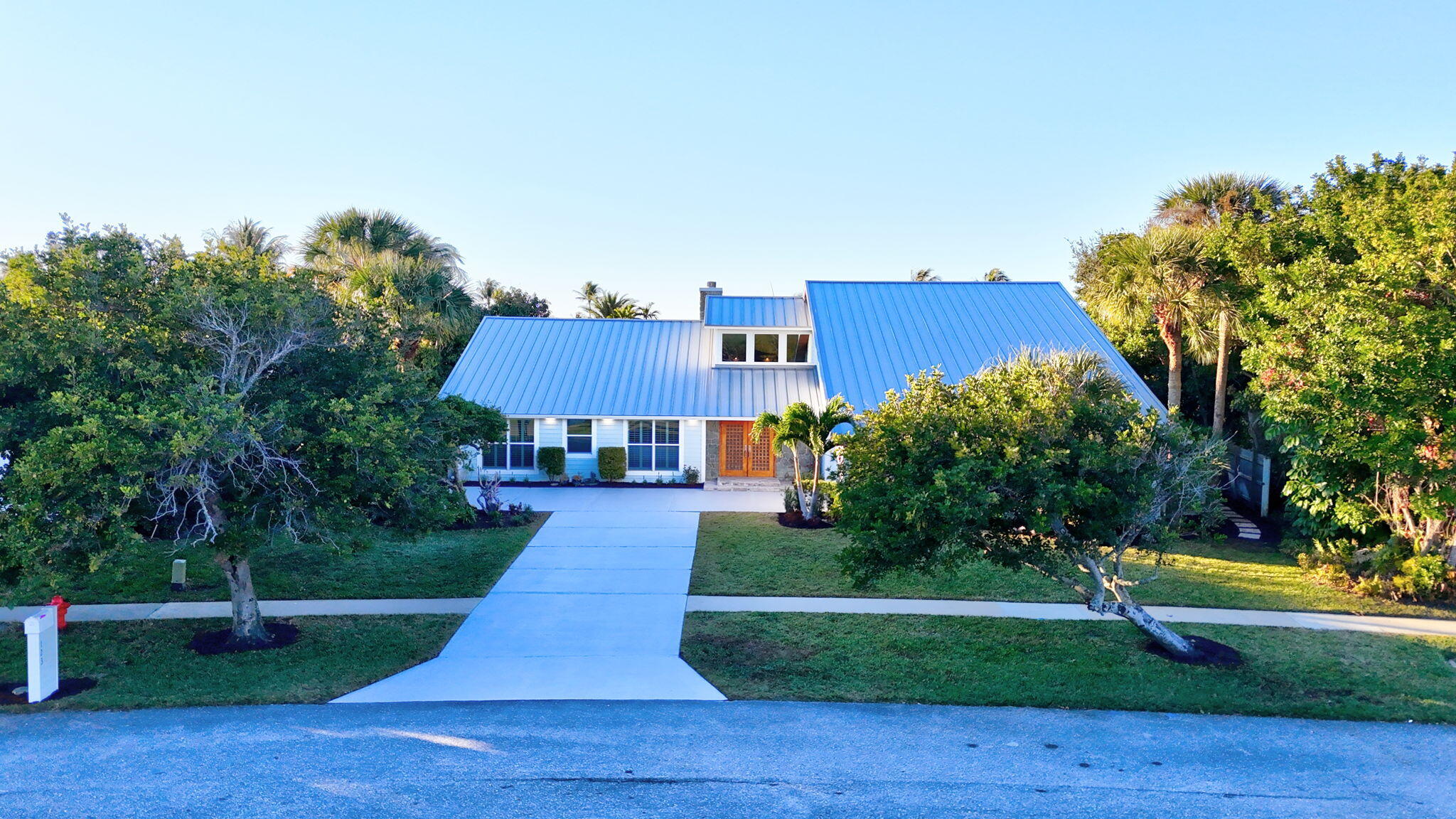 123 Olympus Way Jupiter, FL 33477 - Photo 89 of 116 a front view of a house with a yard