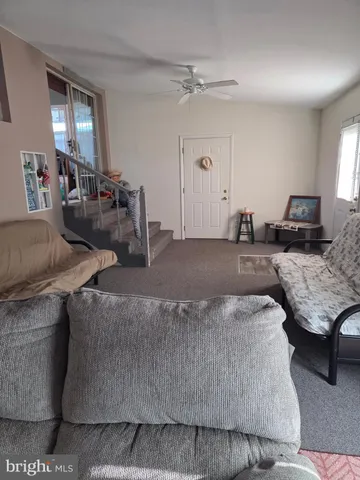 a living room with furniture and flat screen tv