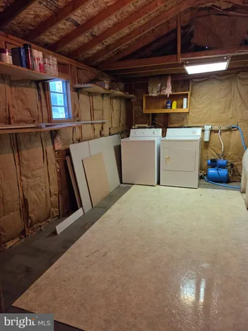 a view of a storage & utility room with stairs