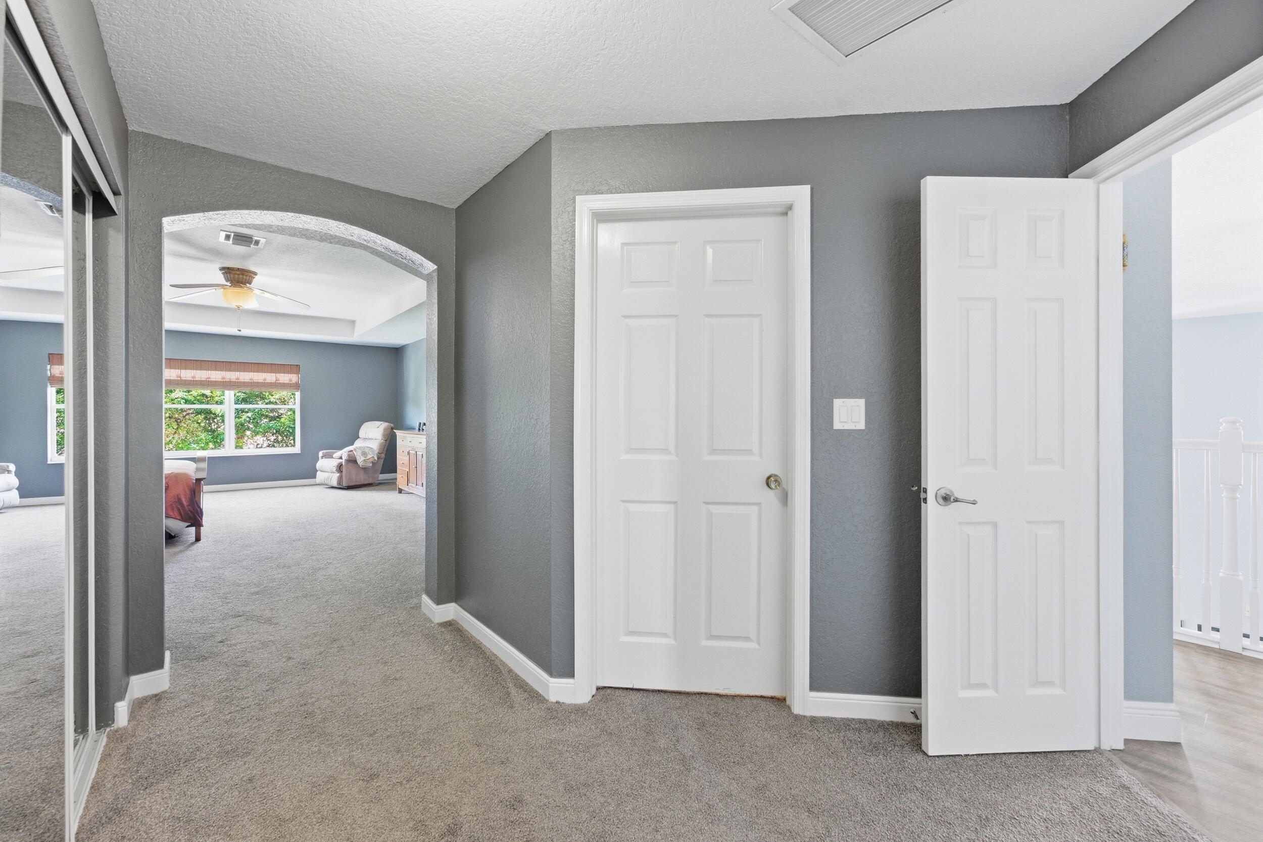3093 Bollard Road West Palm Beach, FL 33411 - Photo 24 of 64 Primary Bedroom Hallway