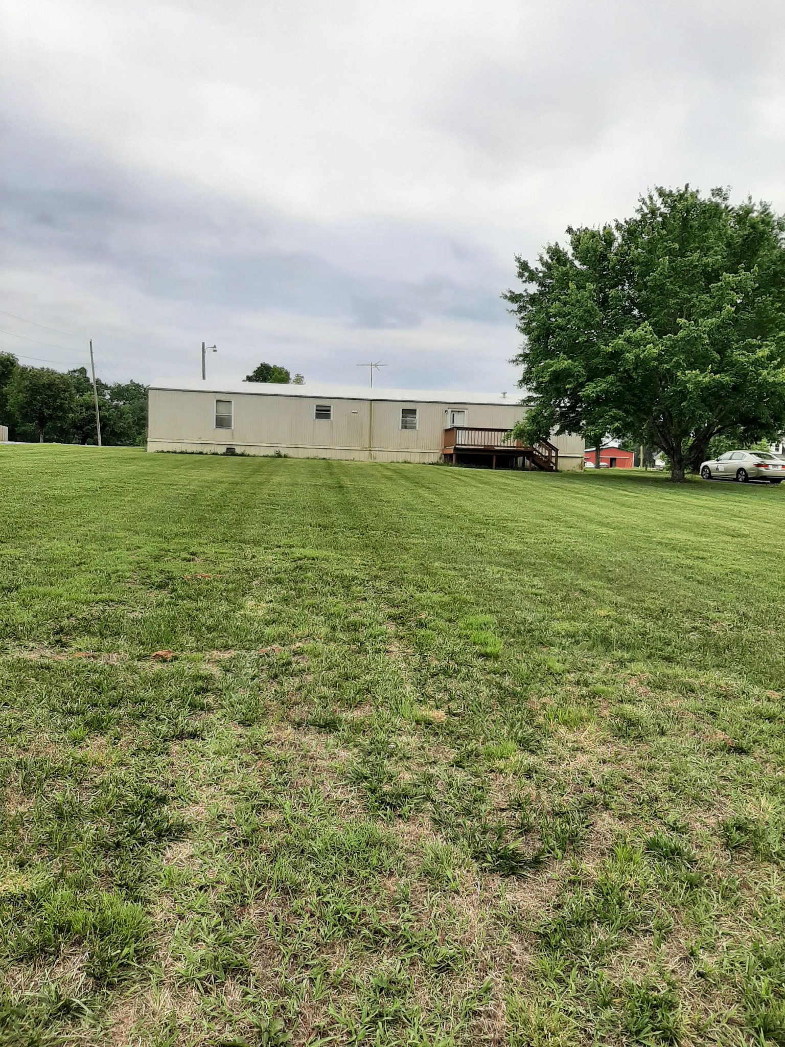 2006 Flat Woods Road Lebanon, TN 37090 - Photo 20 of 24 a view of a field with an ocean and trees in the background