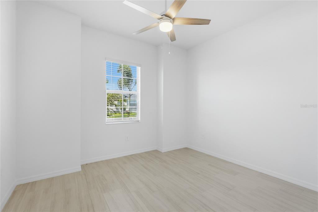 19156 Cherrystone Way Lakewood Ranch, FL 34211 - Photo 23 of 49 an empty room with a window and ceiling fan