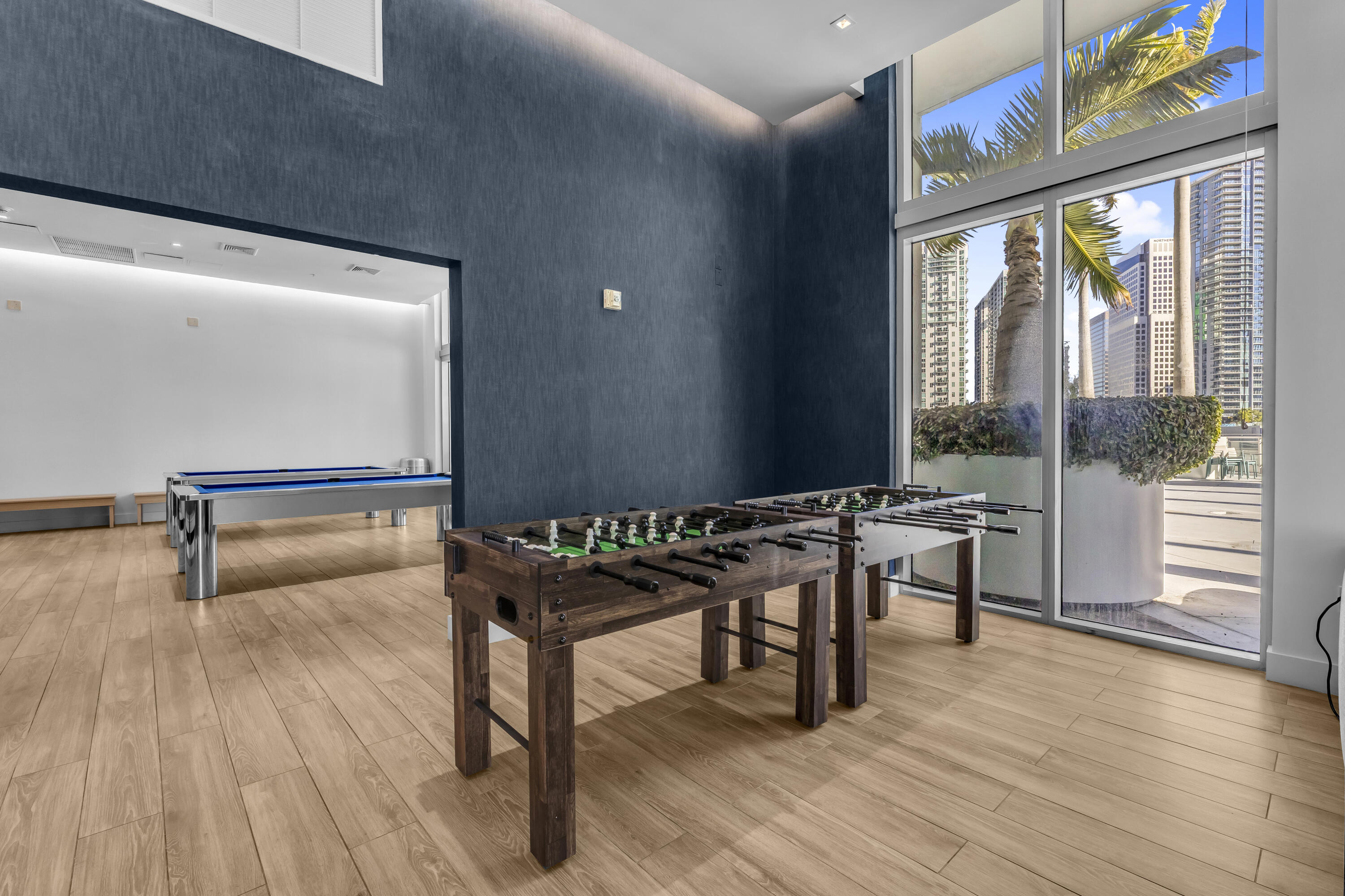 90 Southwest 3rd Street, Unit TH700A Miami, FL 33130 - Photo 23 of 32 a view of a room with furniture window and wooden floor