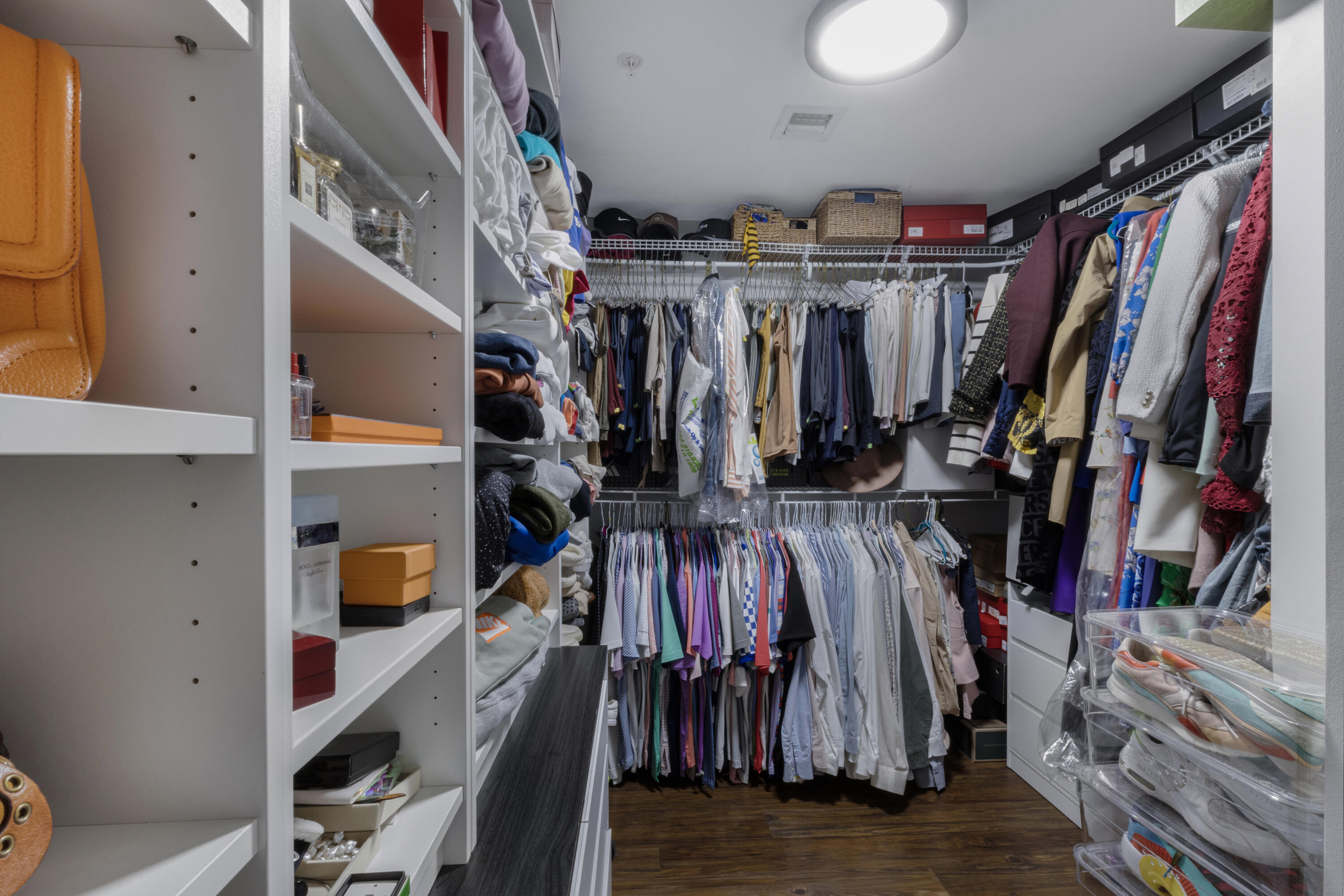 90 Southwest 3rd Street, Unit TH700A Miami, FL 33130 - Photo 9 of 32 a view of walk in closet with clothes and shoes