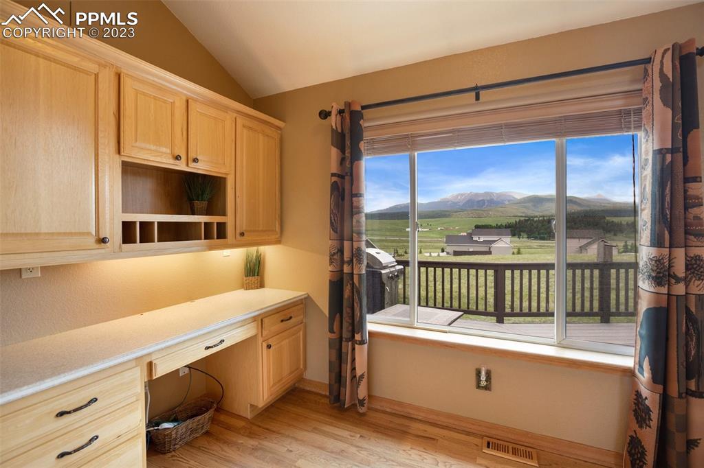 113 Matthew Road Divide, CO 80814 - Photo 13 of 49 a storage room with wooden floor and windows