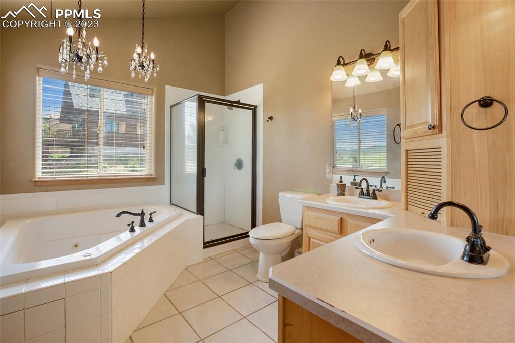 113 Matthew Road Divide, CO 80814 - Photo 19 of 49 a bath room with a sink a mirror and a shower