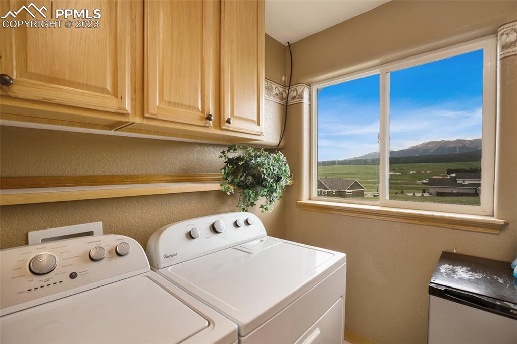113 Matthew Road Divide, CO 80814 - Photo 20 of 49 a utility room with dryer and washer
