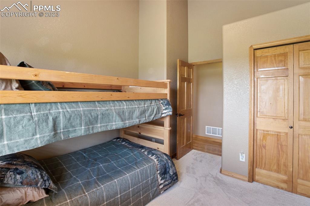 113 Matthew Road Divide, CO 80814 - Photo 26 of 49 a bedroom with a bed and a window