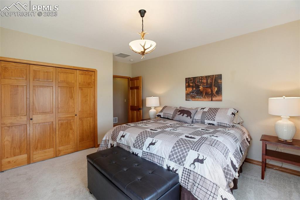 113 Matthew Road Divide, CO 80814 - Photo 27 of 49 a bedroom with a bed and a table