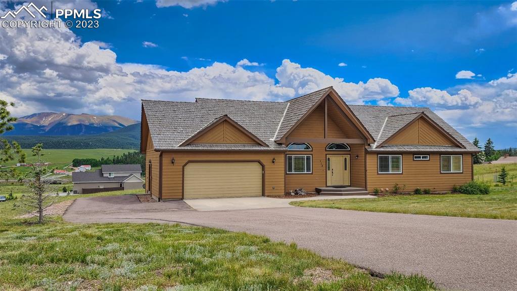 113 Matthew Road Divide, CO 80814 - Photo 41 of 49 front view of house with a yard