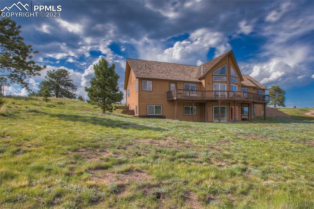 113 Matthew Road Divide, CO 80814 - Photo 44 of 49 a front view of a house with a yard