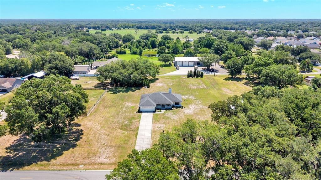 8525 North Campbell Road Lakeland, FL 33810 - Photo 44 of 45 an aerial view of a house with yard swimming pool and outdoor seating