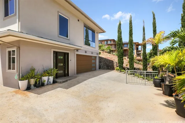 a view of a building with potted plants