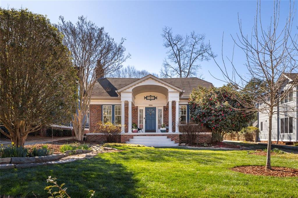 338 West Hill Street Decatur, GA 30030 - Photo 1 of 1 a view of a house with a big yard and large trees