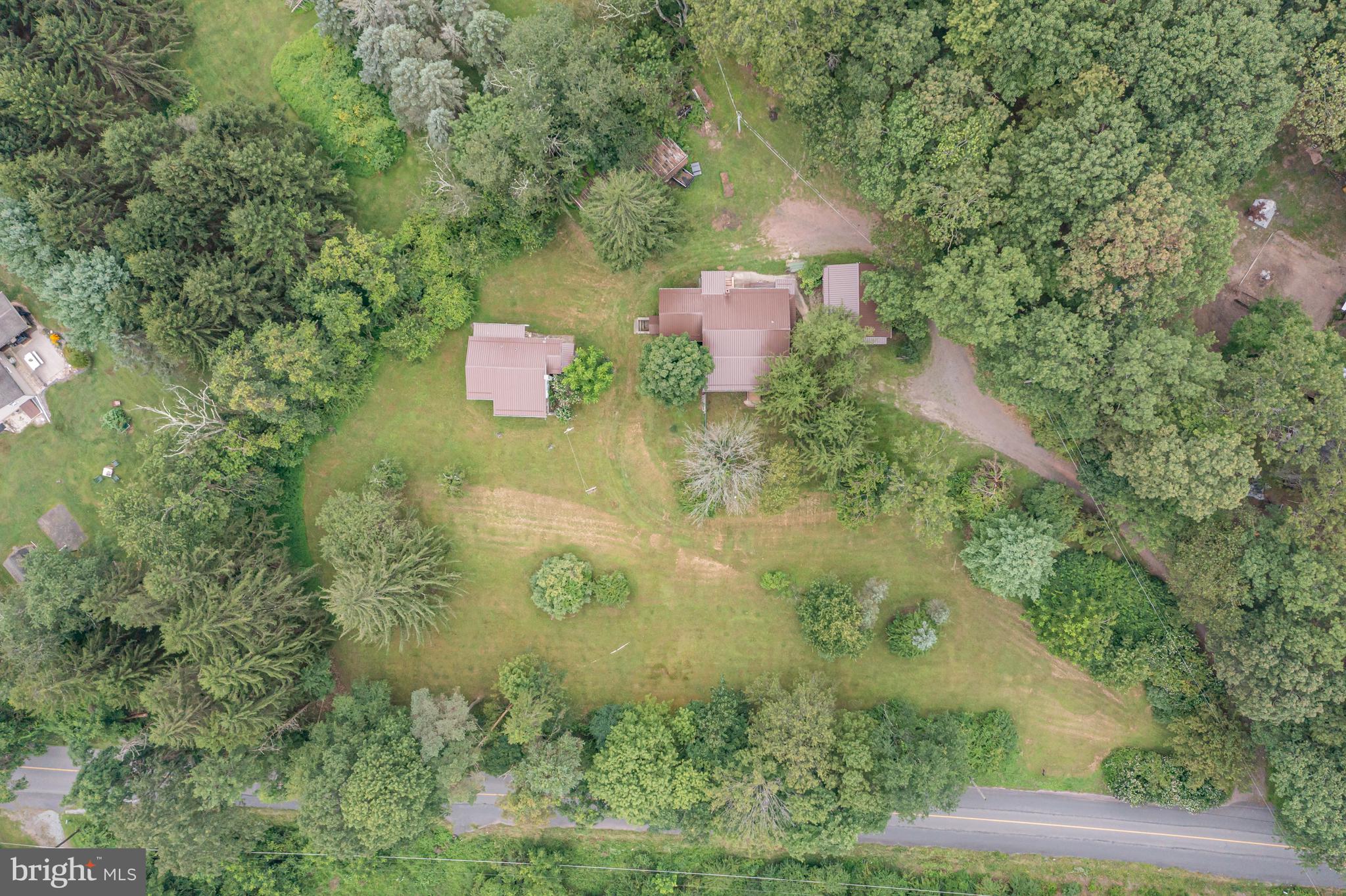 an aerial view of residential house with outdoor space