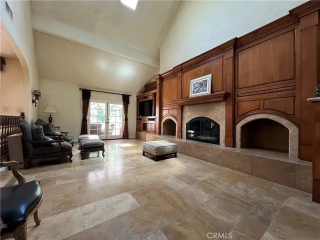a kitchen with stainless steel appliances granite countertop a sink refrigerator and cabinets