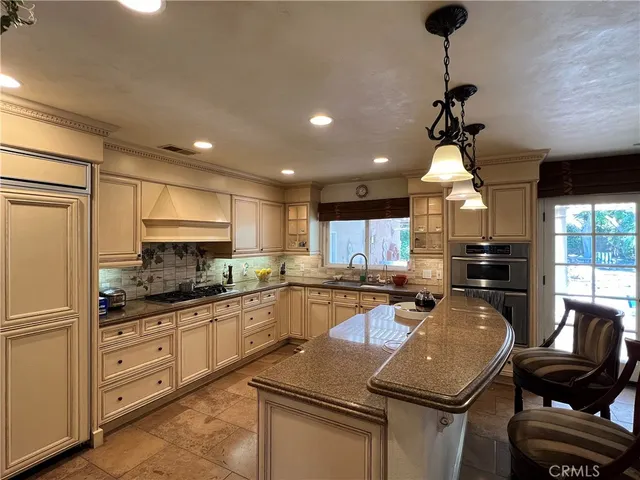 a view of a livingroom with furniture and a kitchen