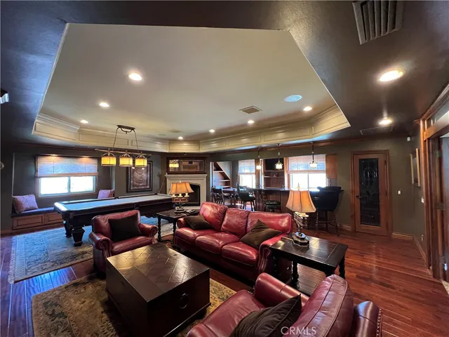 a view of room with wooden floor and windows