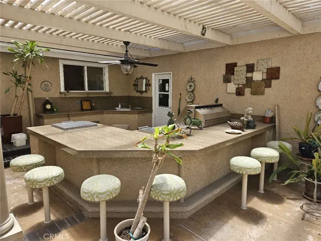 a view of a livingroom with furniture and a window