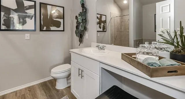 a bedroom with a bed and a lamp on table