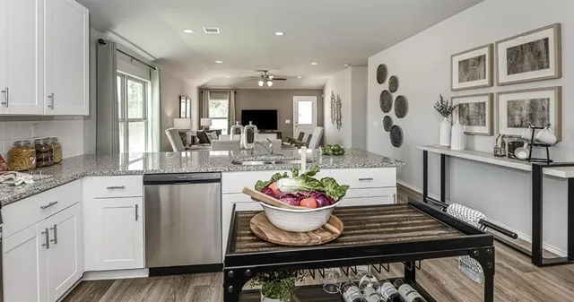 a kitchen with a table and chairs