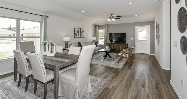 a view of a dining room with furniture window and wooden floor