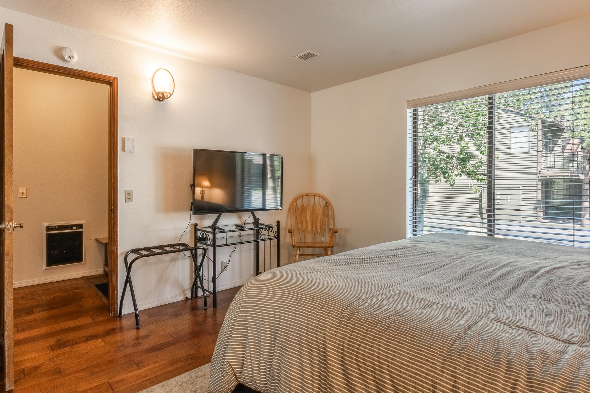 354 Joaquin Road, Unit 4 Mammoth Lakes, CA 93546 - Photo 31 of 40 Bedroom with heating unit and wood finished floors