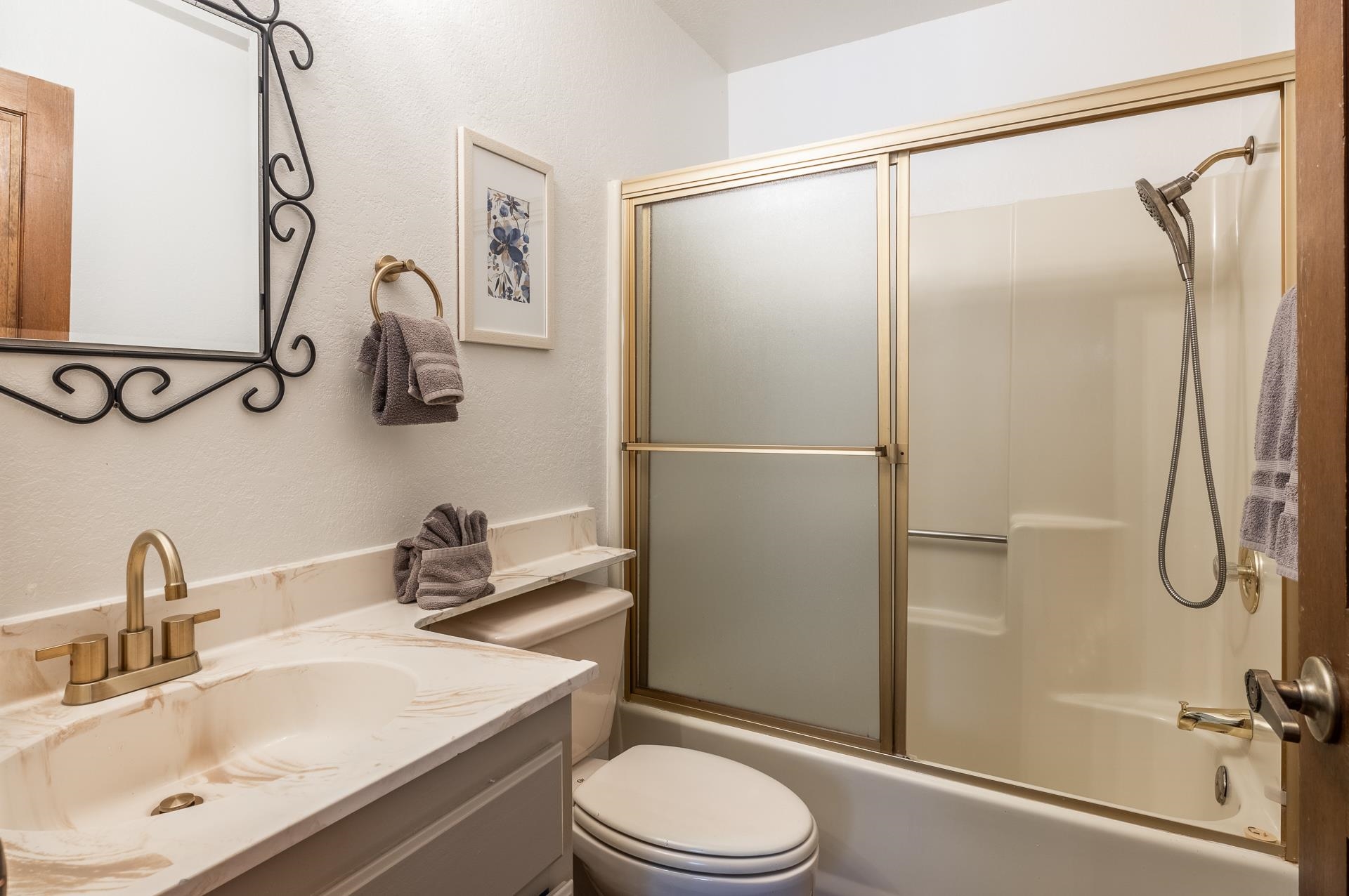 354 Joaquin Road, Unit 4 Mammoth Lakes, CA 93546 - Photo 33 of 40 Full bath with vanity, bath / shower combo with glass door, and a textured wall