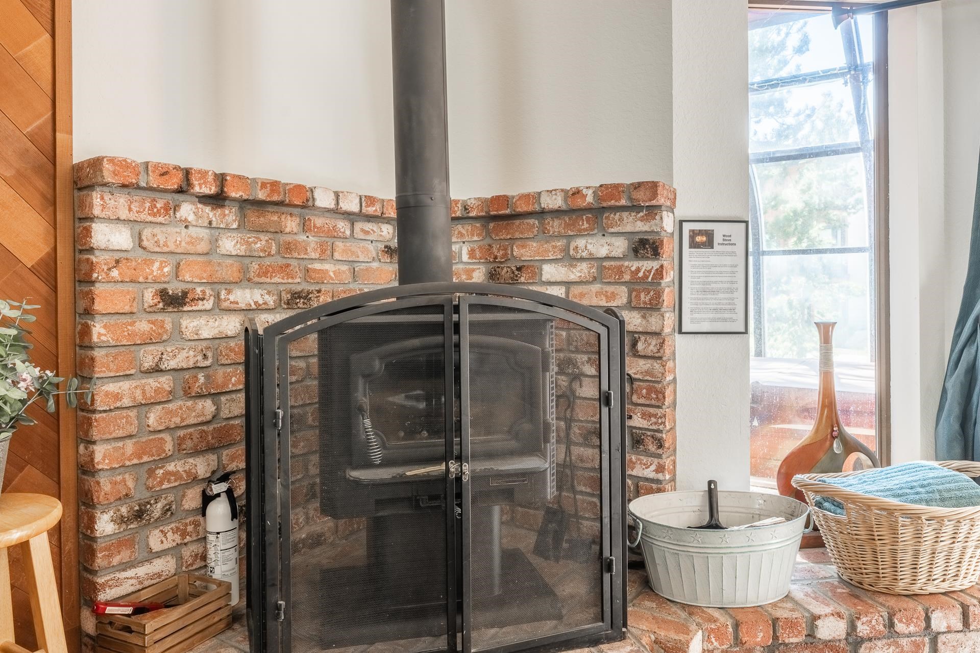 354 Joaquin Road, Unit 4 Mammoth Lakes, CA 93546 - Photo 8 of 40 Detailed view of a fire extinguisher and a wood stove