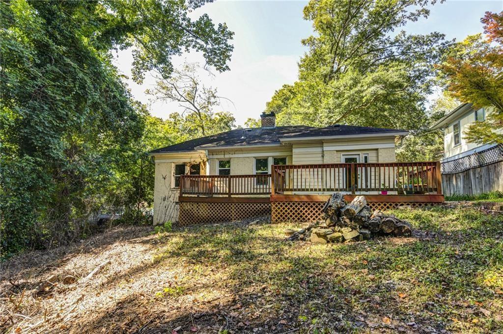 483 Burlington Road Northeast Atlanta, GA 30307 - Photo 18 of 18 a house with trees in the background