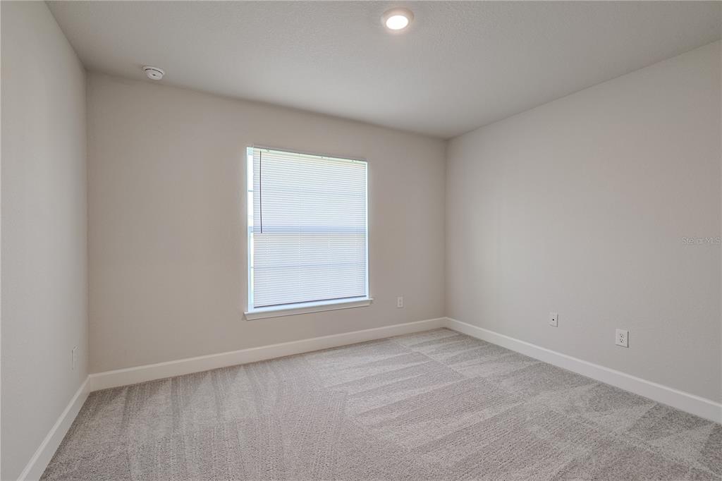 10939 Southwest 41st Avenue Ocala, FL 34476 - Photo 25 of 40 an empty room with a window
