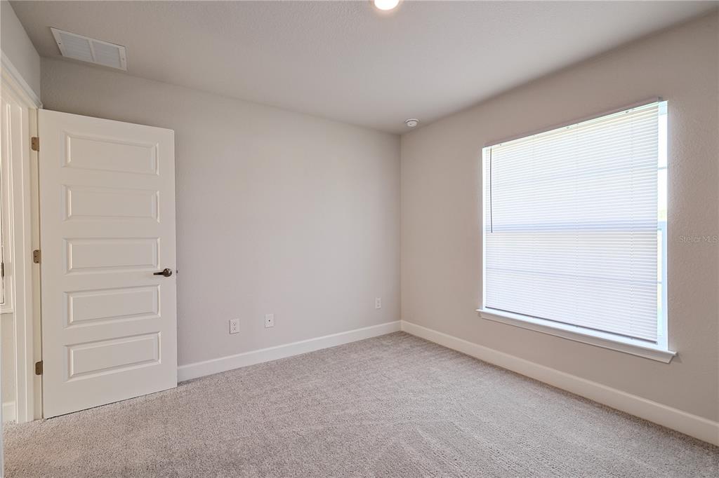 10939 Southwest 41st Avenue Ocala, FL 34476 - Photo 28 of 40 an empty room with a window