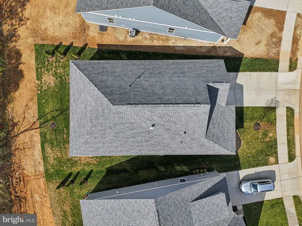 a aerial view of a house with a yard