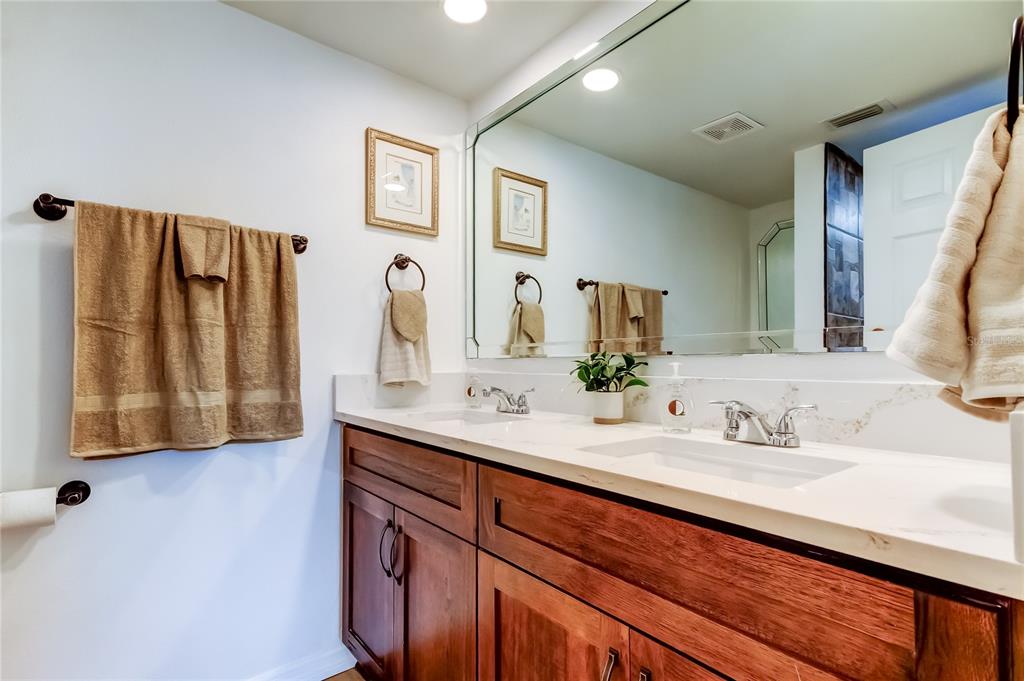 3625 Delta Place Holiday, FL 34691 - Photo 13 of 48 a bathroom with a sink and a mirror