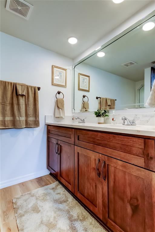 3625 Delta Place Holiday, FL 34691 - Photo 14 of 48 a bathroom with a granite countertop sink and a mirror