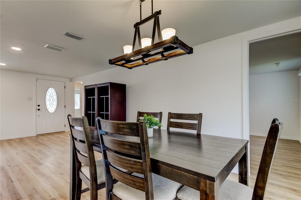 3625 Delta Place Holiday, FL 34691 - Photo 17 of 48 a view of a dining room with furniture