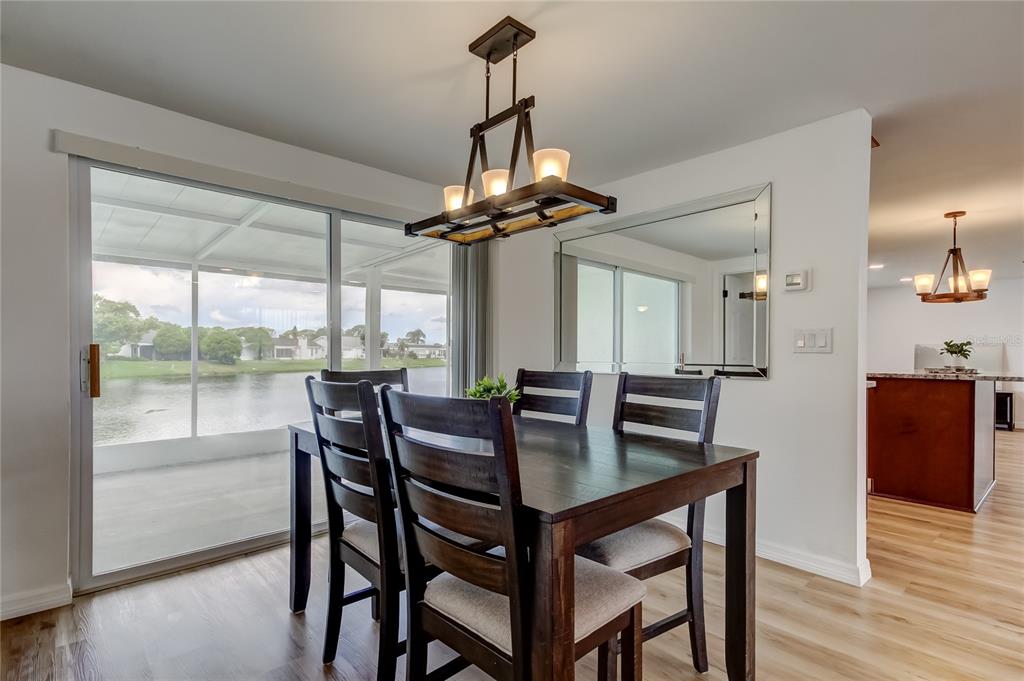 3625 Delta Place Holiday, FL 34691 - Photo 18 of 48 a view of a dining room with furniture window and wooden floor