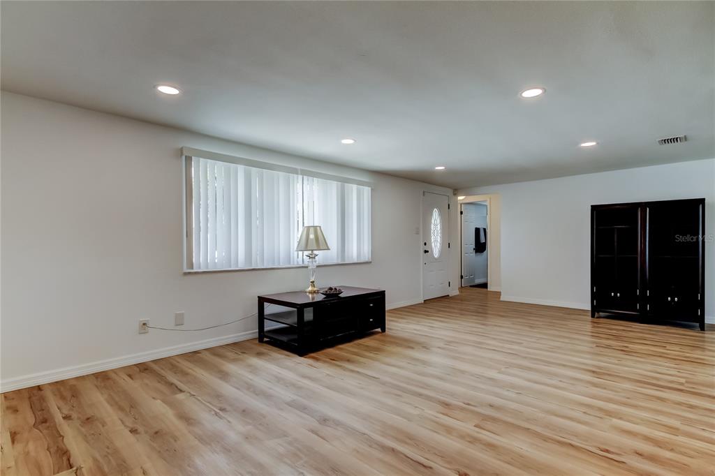 3625 Delta Place Holiday, FL 34691 - Photo 19 of 48 wooden floor in an empty room with a window