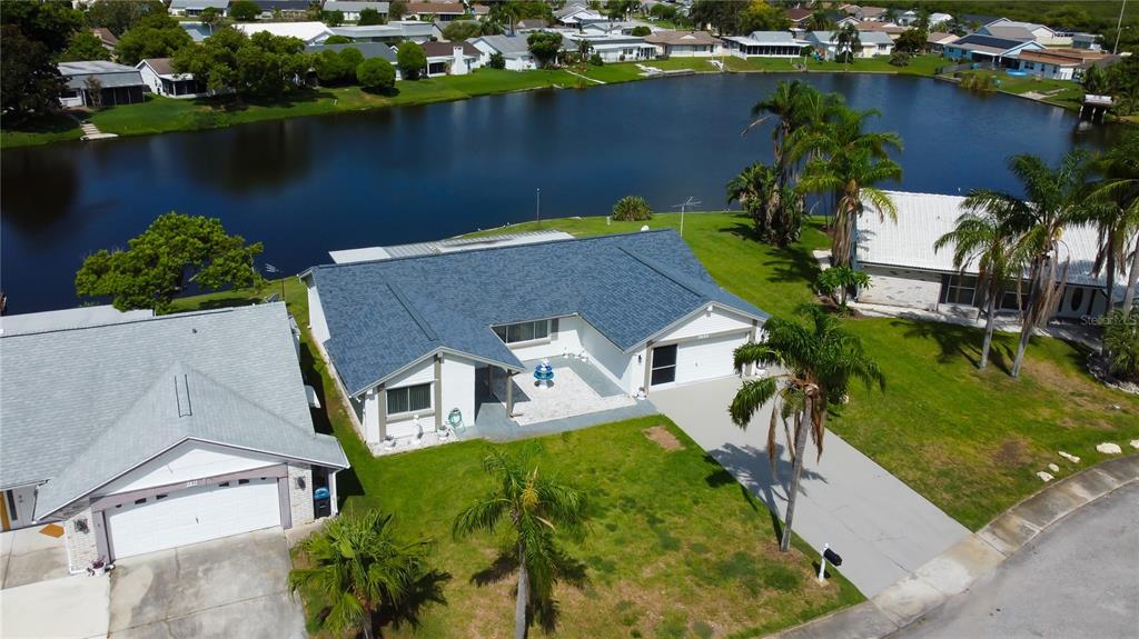 3625 Delta Place Holiday, FL 34691 - Photo 2 of 48 an aerial view of a house with a lake view