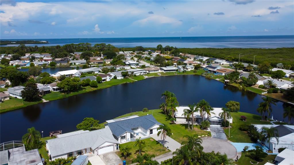3625 Delta Place Holiday, FL 34691 - Photo 36 of 48 an aerial view of a house with a lake view