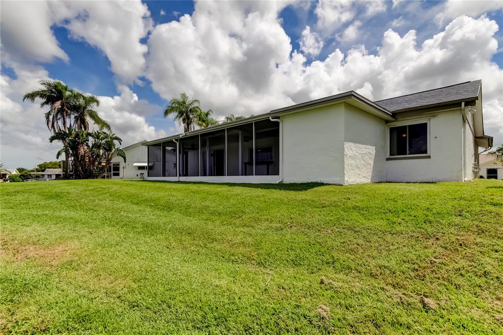3625 Delta Place Holiday, FL 34691 - Photo 43 of 48 a house view with swimming pool and garden space