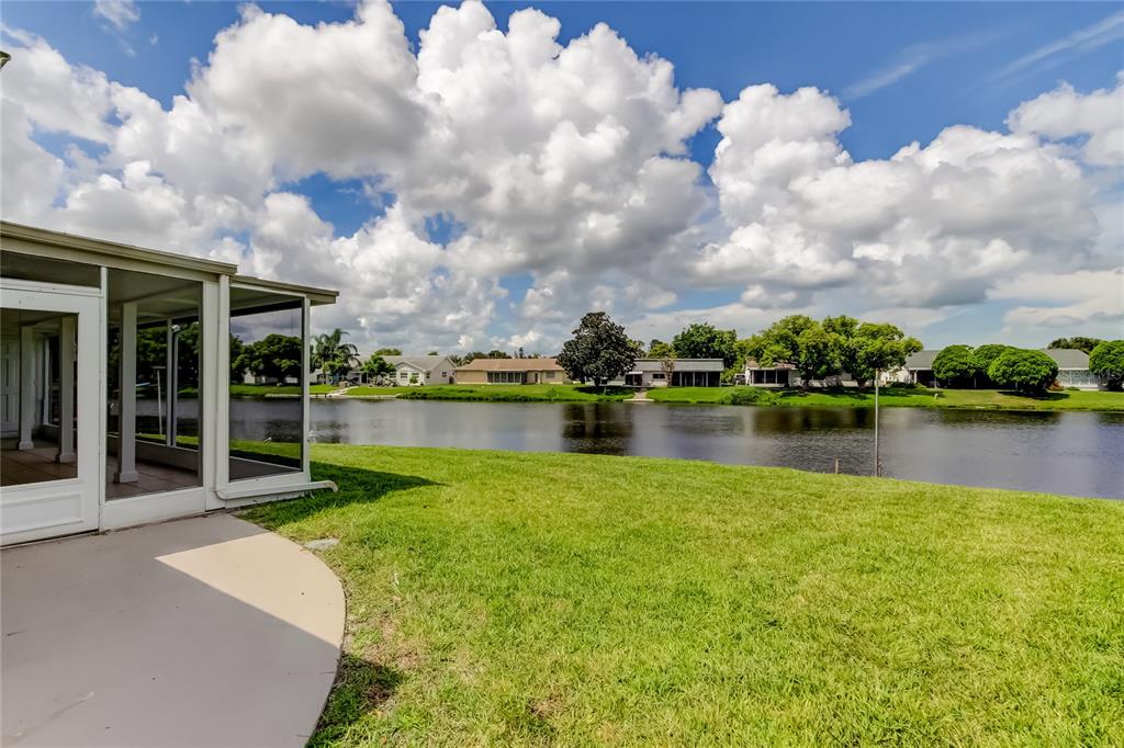3625 Delta Place Holiday, FL 34691 - Photo 46 of 48 a view of a lake with a house in the background