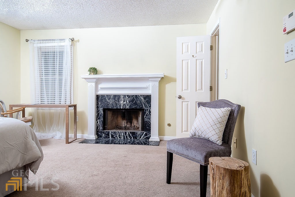 570 Reed Street Southeast Atlanta, GA 30312 - Photo 5 of 11 a living room with furniture and a fireplace