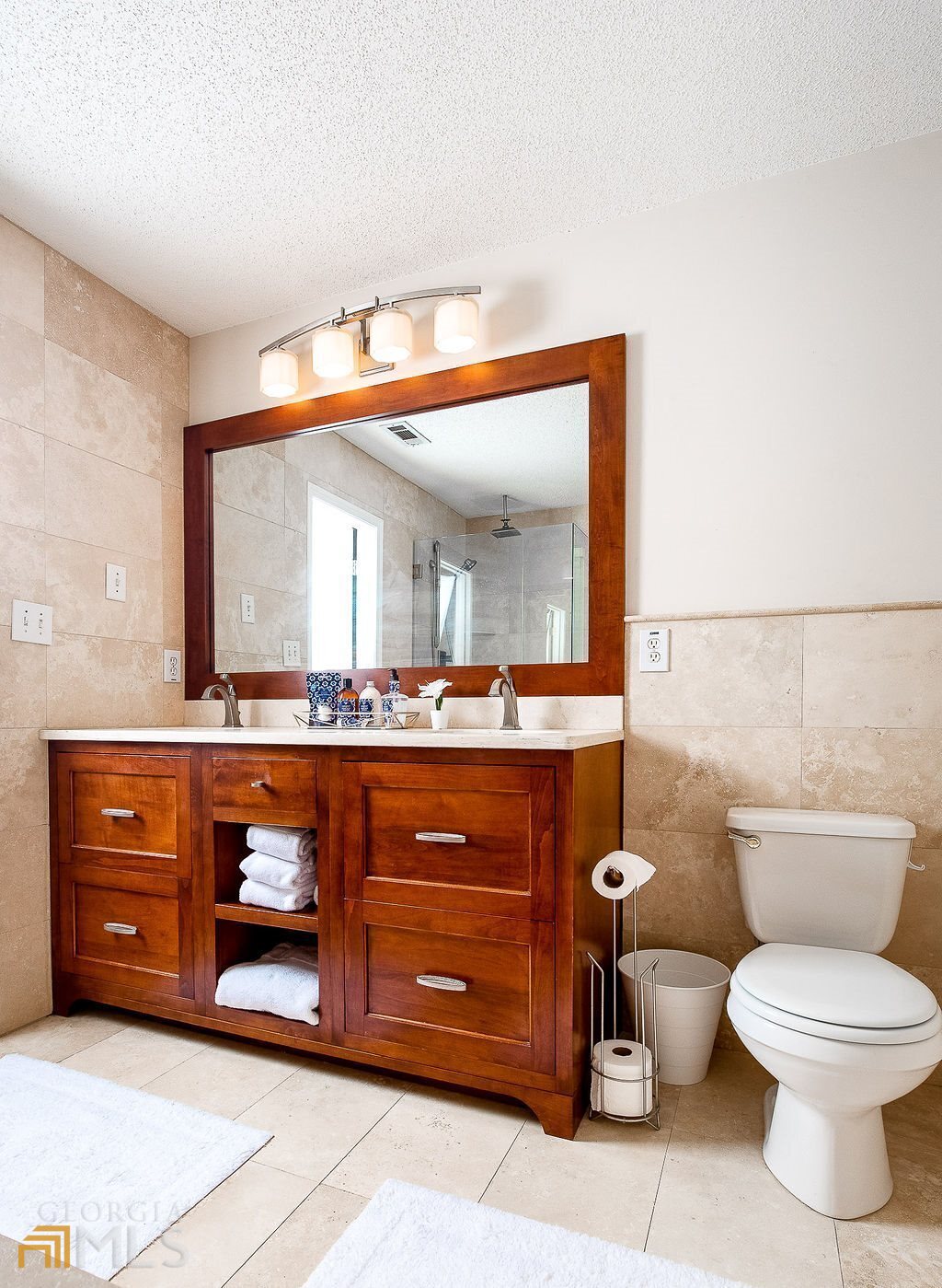 570 Reed Street Southeast Atlanta, GA 30312 - Photo 6 of 11 a bathroom with a toilet a sink and mirror
