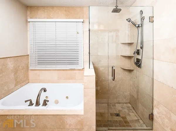 a bathroom with a sink a toilet and shower curtain
