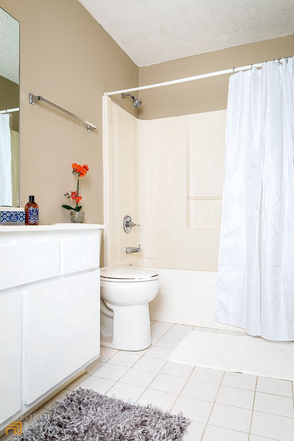 570 Reed Street Southeast Atlanta, GA 30312 - Photo 8 of 11 a bathroom with a sink a toilet and shower curtain
